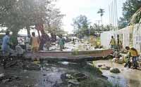Solomon Islands villagers bury their dead, too afraid to return home