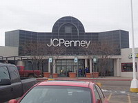 JC Penney Company reports net income drop by half