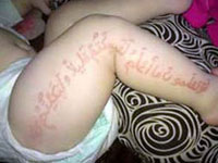 Quran Inscriptions Appear on Little Boy's Body - New Show for the Masses?