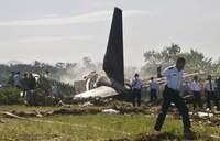 Investigators identify charred victims of Indonesian plane crash