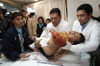 Relatives seek for beloved in body bags after Peru quake