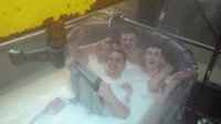 Naked employees of cheese factory bathe in milk tank. 52465.jpeg