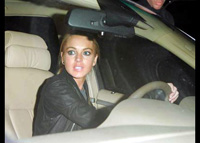 Lindsay Lohan checks into rehab center after weekend car crash and DUI arrest