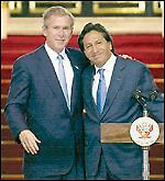 Presidents George W. Bush and Alejandro Toledo (Peru) seem to be happy about the free trade deal. Millions of Peruvians do not