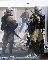 British defense secretary defends soldiers beating Iraqi civilians