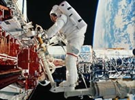 Spacewalking on 100-foot extension works all right, astronauts say