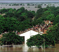 Rescuers save Mozambican villagers stranded by floodwaters in dugouts
