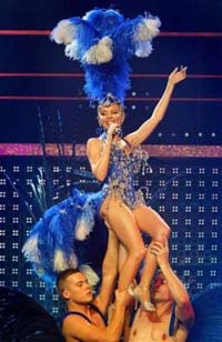 Kylie Minogue grows short spiky hair after therapy and prepares to return on stage