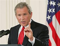 President George W. Bush consults military leaders about Iraq