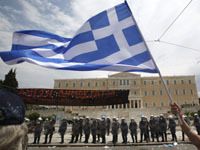 Greece to approve final austerity bill to secure 12 billion euros of international aid. 44792.jpeg