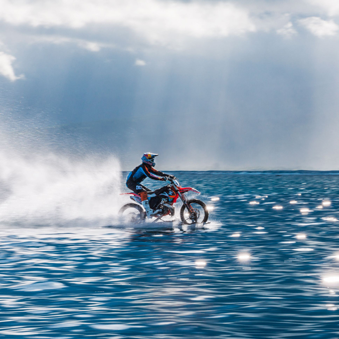 Riding a bike on waves