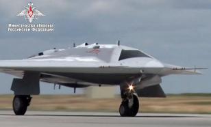 S-70 Okhotnik heavy combat drone flies escorted by fighter jet – Video