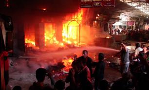 In Mosul market on fire because of shelling. Video