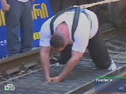 Athlete sets new world record pulling 12 freight cars