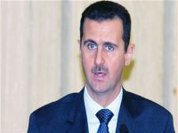 Assad warns west