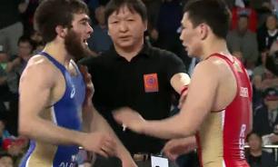 Riot police interfere to pull apart fighting athletes at Russian Wrestling Championship