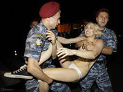 Femen activists attack sleeping 'dictator' Lukashenko