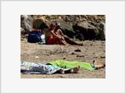 Italy shocked with photos of beach-goers sunbathing near dead bodies of drowned girls